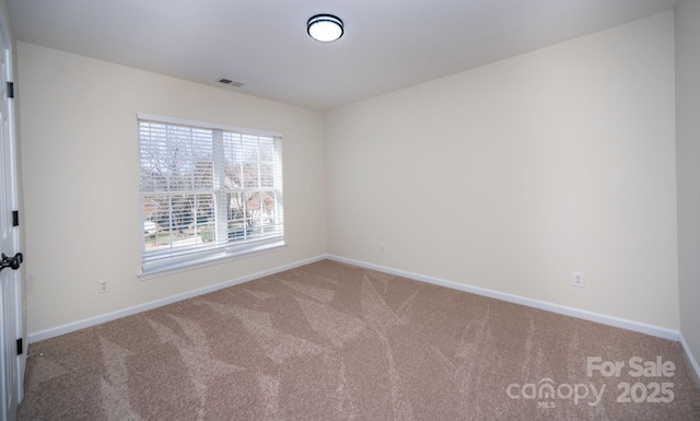 spare room with carpet flooring