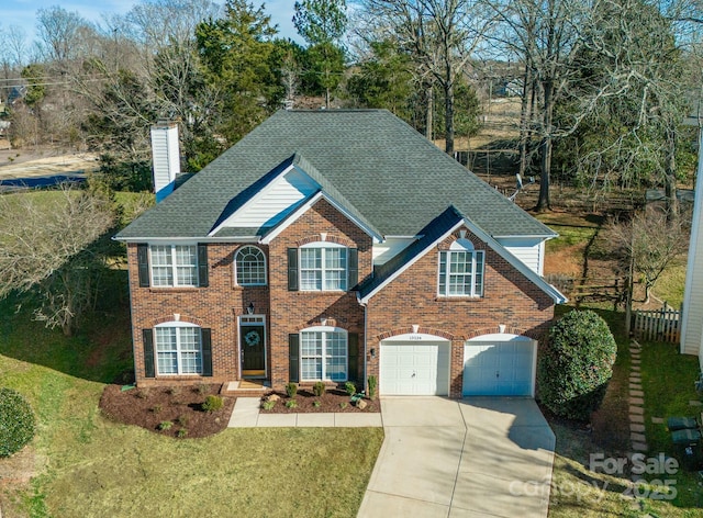 view of front of house featuring a garage and a front yard