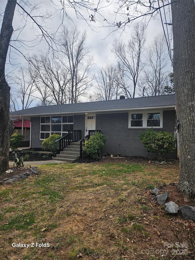 view of front of property featuring brick siding