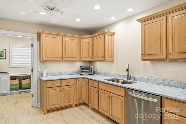 kitchen featuring light stone counters, sink, dishwasher, and ceiling fan