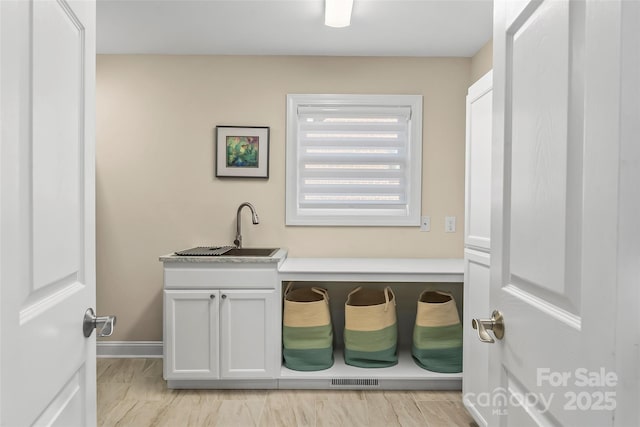 laundry area with sink