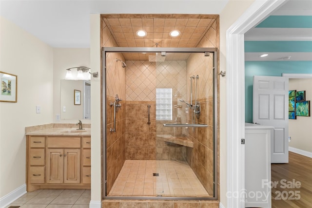 bathroom featuring vanity, tile patterned flooring, and walk in shower