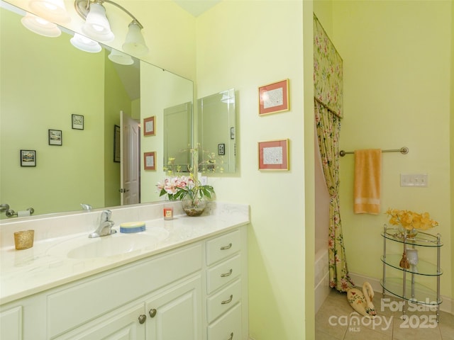 bathroom with tile patterned floors, shower / tub combo, and vanity