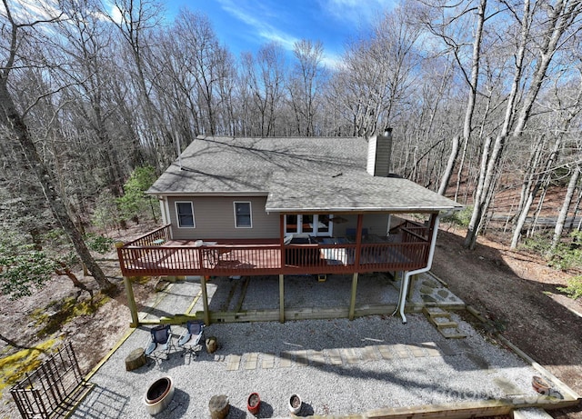 rear view of property with a deck