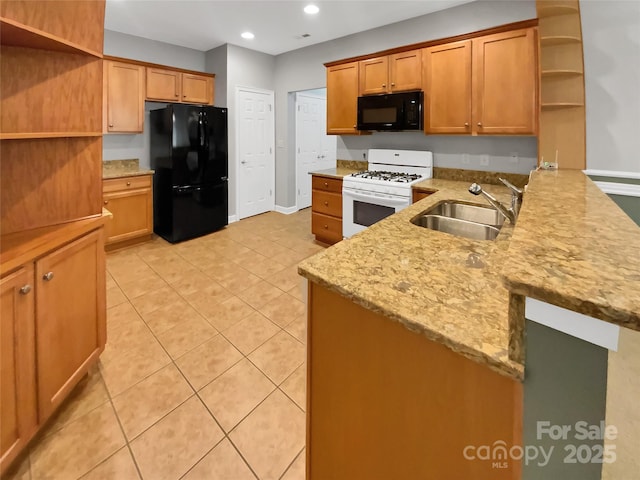 kitchen featuring light tile patterned flooring, sink, kitchen peninsula, light stone countertops, and black appliances