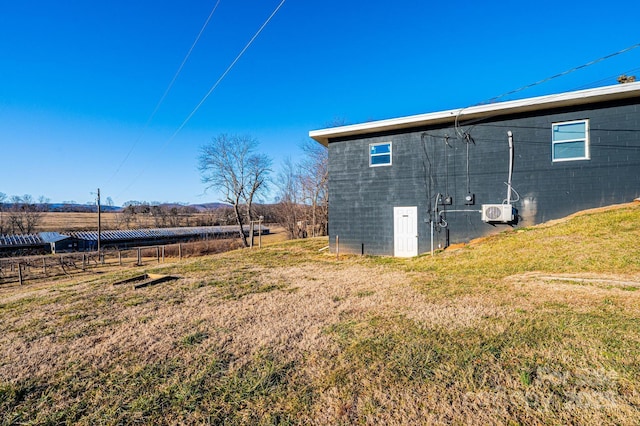 view of yard with a rural view