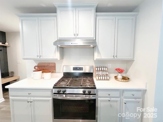 kitchen with white cabinetry and gas range