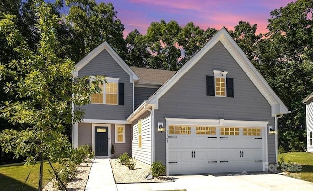 view of front of property with a garage