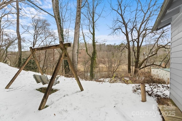 view of yard layered in snow