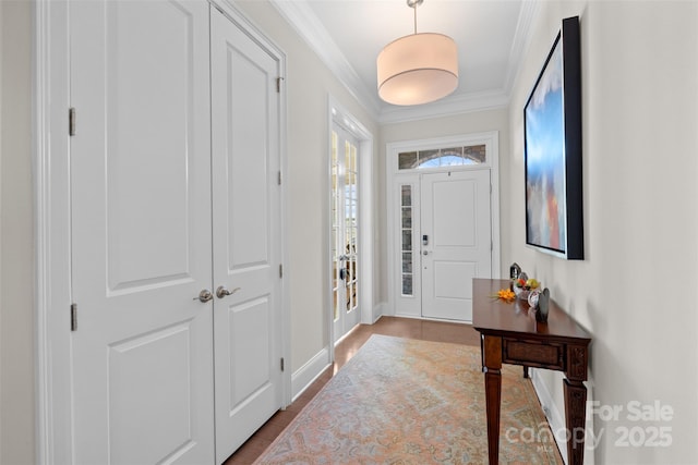 entryway featuring ornamental molding and hardwood / wood-style floors