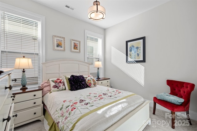 bedroom with light carpet