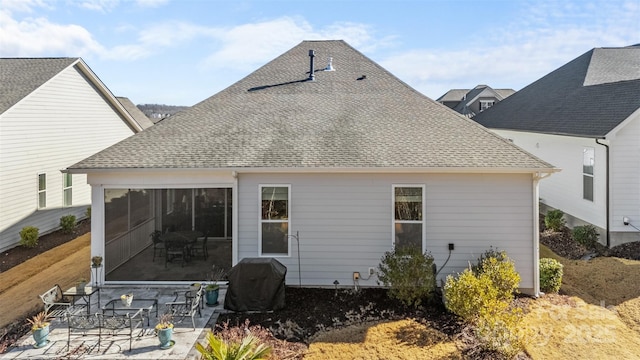 rear view of property with a patio area