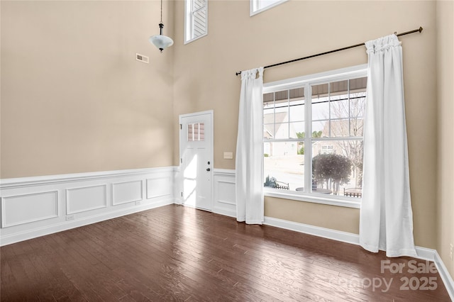 interior space with dark hardwood / wood-style flooring