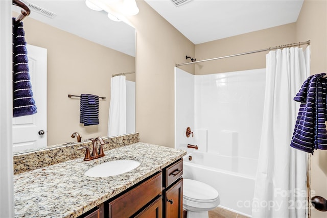 full bathroom featuring shower / bath combo, vanity, and toilet