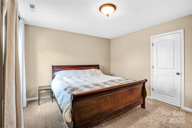 bedroom featuring light carpet