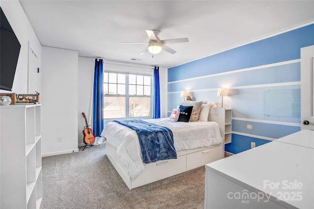 bedroom featuring ceiling fan and carpet