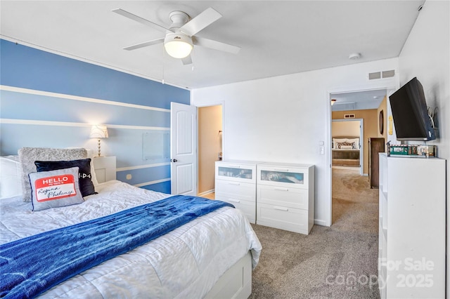 bedroom featuring ceiling fan and light carpet