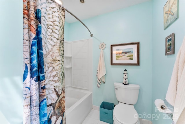 bathroom featuring shower / tub combo and toilet