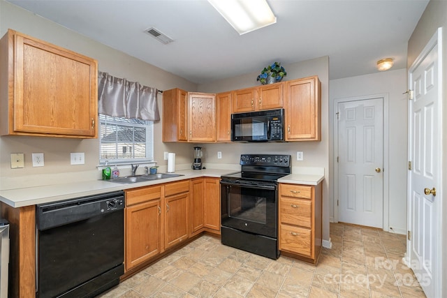 kitchen featuring sink and black appliances