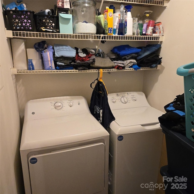 clothes washing area with washer and dryer