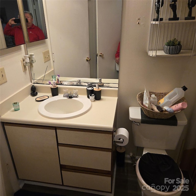 bathroom with vanity and toilet