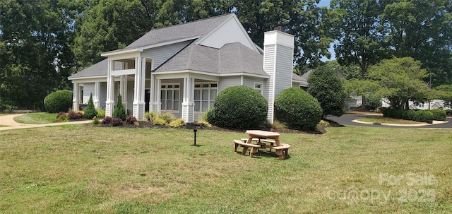 view of side of home featuring a yard