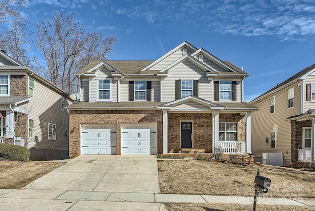 view of front of home with a porch and a garage