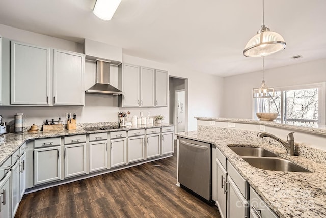 kitchen with wall chimney exhaust hood, sink, hanging light fixtures, dark hardwood / wood-style flooring, and dishwasher