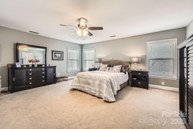 carpeted bedroom with ceiling fan