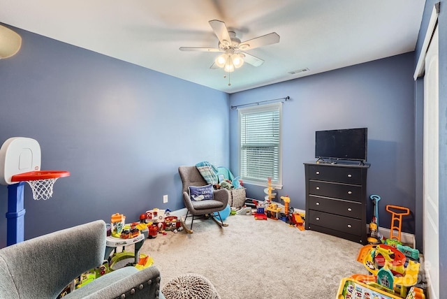 game room featuring ceiling fan and carpet