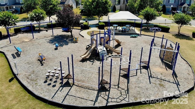 view of property's community with a playground