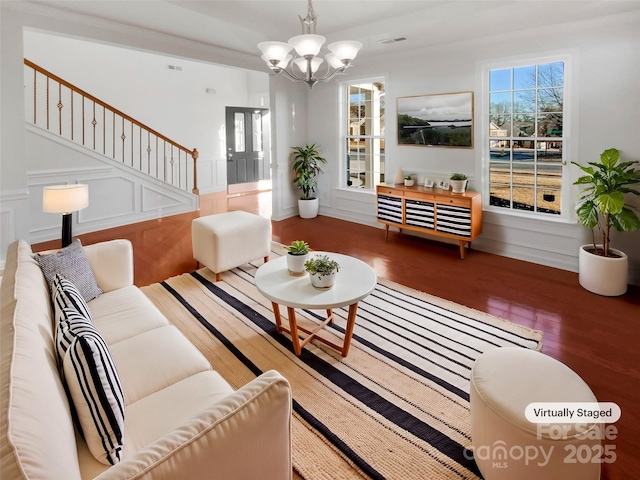 living room featuring dark hardwood / wood-style floors and a notable chandelier