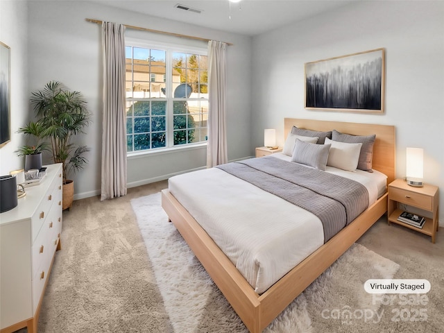 bedroom featuring light colored carpet