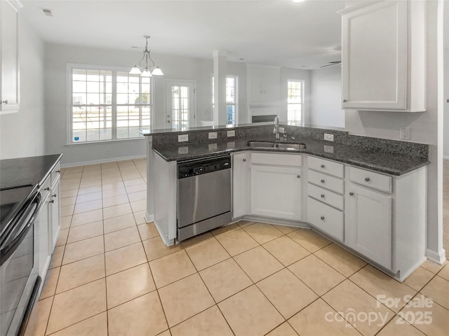 kitchen featuring dark stone countertops, sink, white cabinets, and appliances with stainless steel finishes