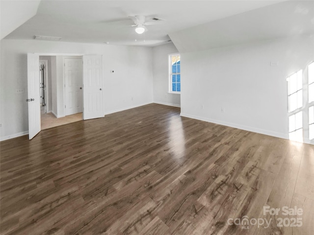 unfurnished living room featuring dark hardwood / wood-style floors and ceiling fan