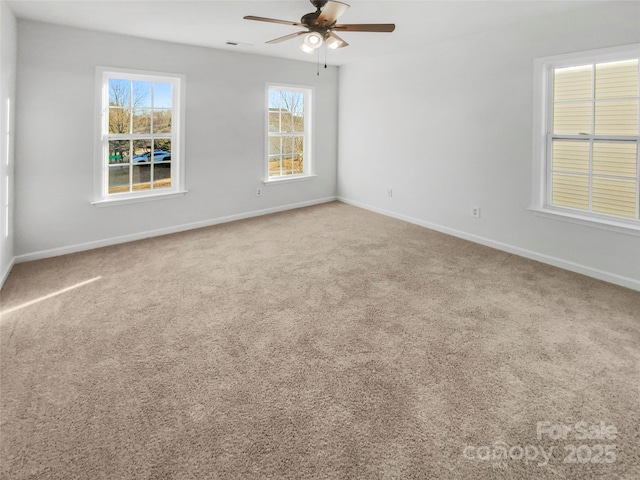 unfurnished room with carpet flooring and ceiling fan