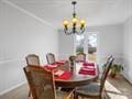 dining room with breakfast area and an inviting chandelier