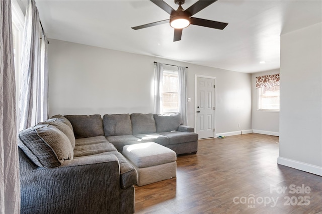 living room with ceiling fan and wood-type flooring