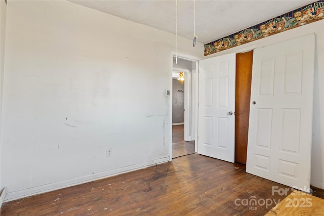 spare room with dark hardwood / wood-style flooring