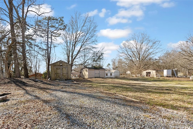 view of yard with a storage shed