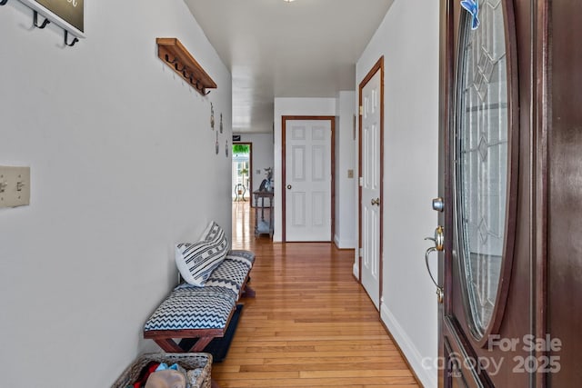 hallway featuring light hardwood / wood-style flooring