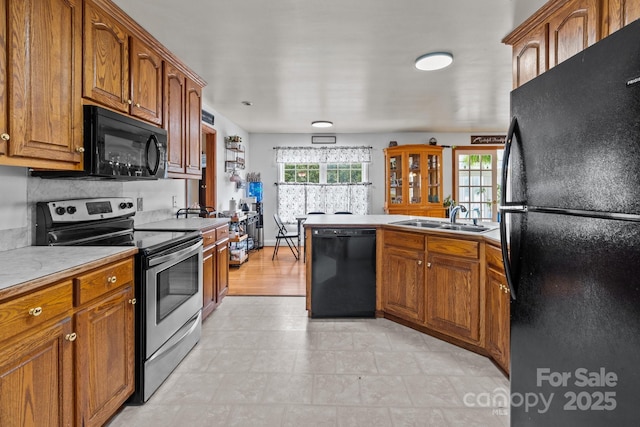 kitchen featuring sink and black appliances