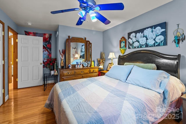 bedroom featuring light hardwood / wood-style flooring and ceiling fan