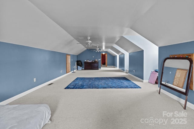 carpeted bedroom with lofted ceiling and ceiling fan