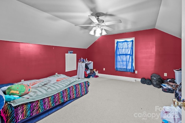 bedroom featuring ceiling fan, lofted ceiling, and carpet flooring