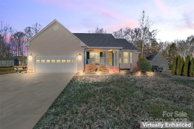 view of front of home featuring a porch and a garage