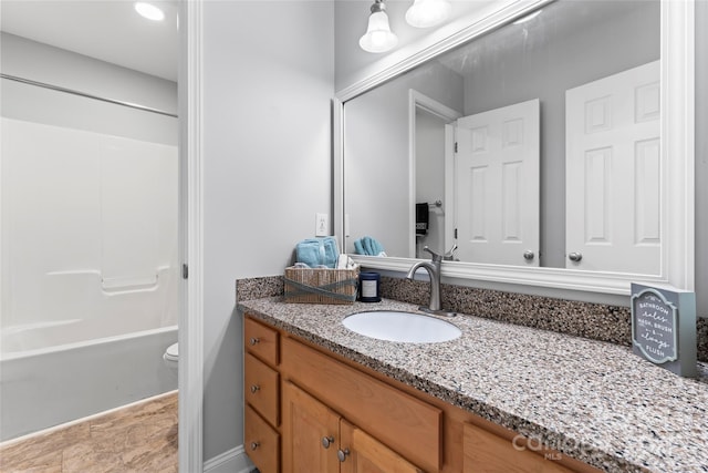 full bathroom with vanity,  shower combination, and toilet