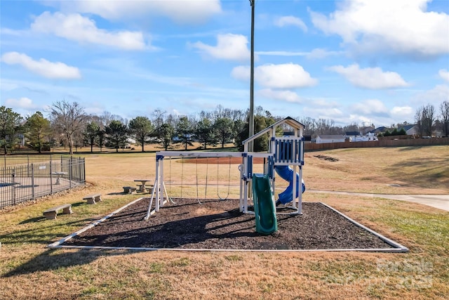 view of playground with a lawn