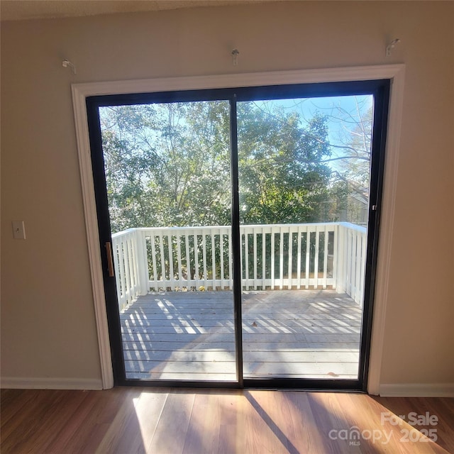 doorway to outside featuring hardwood / wood-style floors