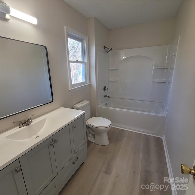 full bathroom featuring shower / tub combination, vanity, toilet, and hardwood / wood-style floors